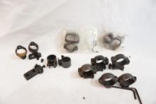 Four sets of scope rings, one with bases