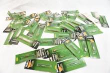 Bag of gun cleaning supplies including bore guides, patch pullers, brushes, mops and adaptors