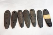 Seven plastic butt plates