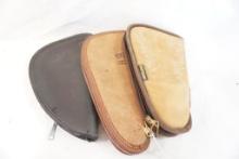 Three leather pistol cases