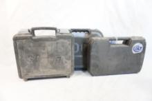 Three plastic pistol cases, one Colt 1911, one Sig Sauer and one Glock