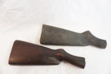Two wood butt stocks, one with crack