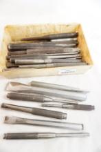 Plastic bin of chisels