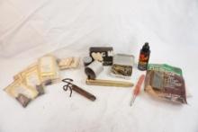 Box of miscellaneous item including scope bases, gold colored railroad spike etc