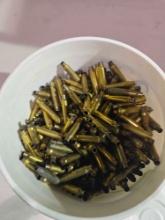 Plastic tub of fired 223 brass.