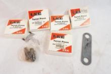 Bag of Lee 4 hole turret quick change turrets. In boxes. Plus miscellaneous press items.