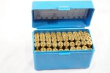 Blue plastic ammo box with 50 new unprimed 7mm Rem Mag brass cases.