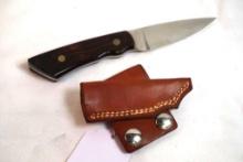 One Yancey slimline fixed blade knife with leather sheath. Looks new.