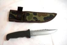 One Buck fixed blade knife with camo nylon sheath.