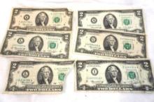 Six 1976 $2 bills all in circulated condition, one is torn with all pieces present