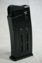 One metal 12 ga shotshell magazine.