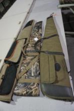 Three soft sided rifle cases.