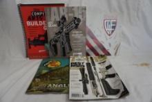 One spiral bound soft book, "The Competitive AR15 Builders Guide, and four gun magazines.