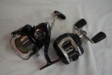 Two fishing reels. One Abu Garcia baitcasting, and one Daiwa spinning reel.