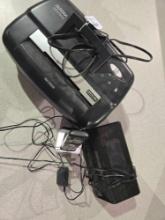 One Aurora paper shredder, digital alarm clock, and one vtech portable phone.