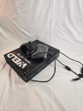 One Xbox WELD racing XT with two controllers.