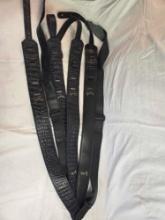 Six leather guitar straps.