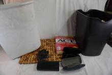 Two wood hot place mats, One ACT prep guide, metal Lotus flower incense burner holder, two waste