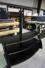 One three-tier glass tops and TV mounting bracket.