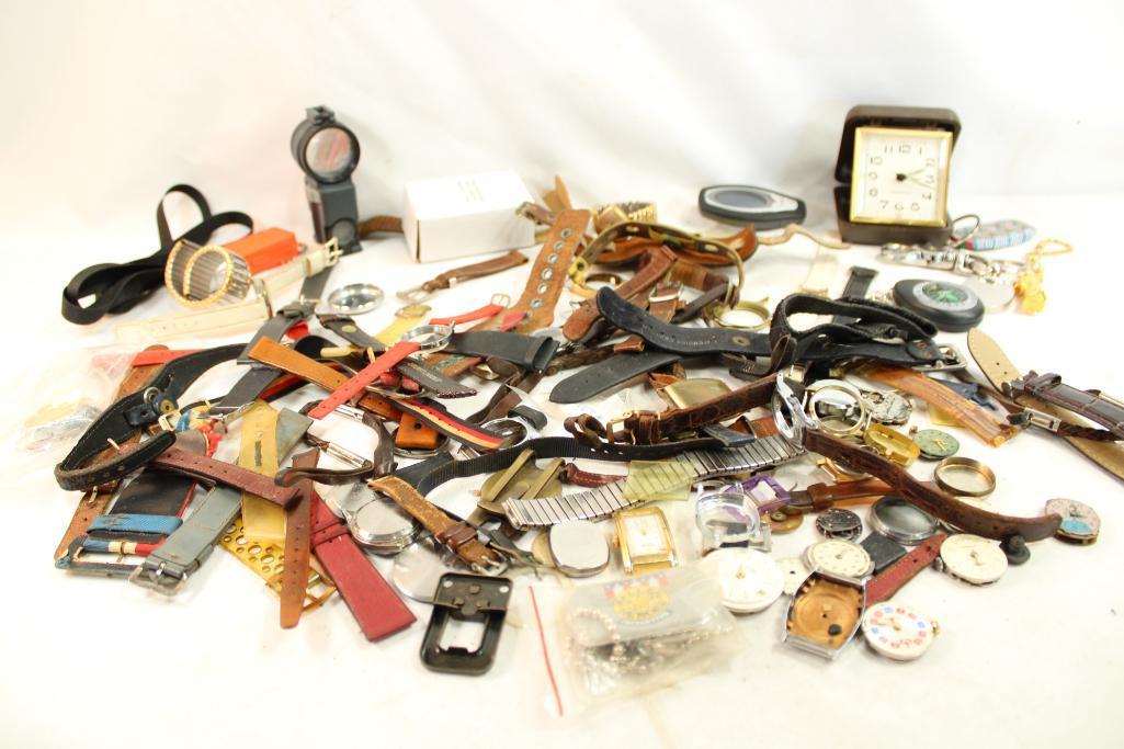 Large bag of watch bands, faces, key chains, clock and other misc items