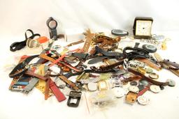 Large bag of watch bands, faces, key chains, clock and other misc items