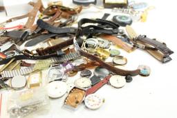 Large bag of watch bands, faces, key chains, clock and other misc items