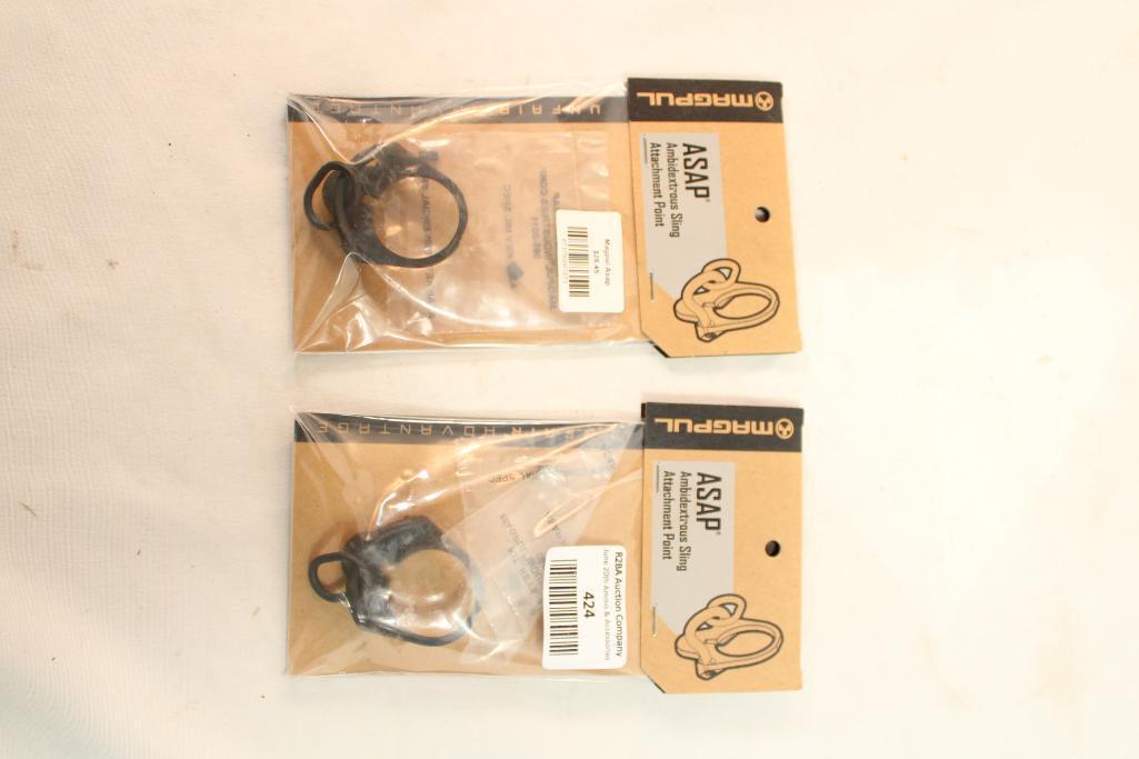 Two MagPul ASAP ambidextrous sling attachments. In packages.