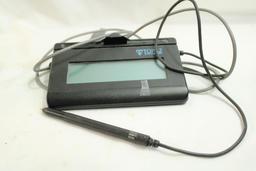 Box containing a Topaz system signature LCD, Alarm Lock infrared printer, Symbol barcode scanner