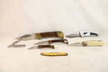 Six folding pocket knives and one multi tool