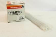 One box of Winchester W209 shotgun primers, count 1000, and 4 primer loading tubes.