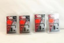 Three CMC trigger anti-walking pin sets. In packages.