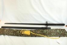 One double pin handle release Samurai sword in silk bag.