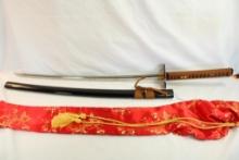 One double pin handle release Samurai sword in silk bag.