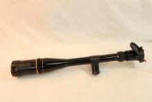One Leupold Premier 6.5-20x40 tactical rifle scope with parallax, extra tactical turret knobs, and