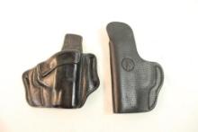 Two leather right handed holsters. One belt and one belt clip.