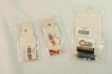 One 1911 recoil spring plug and two Glock trigger springs. In packages.