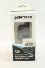 One NightStick weapon light. In box.