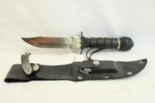 Survival knife with sheath, compass and sharpening stone