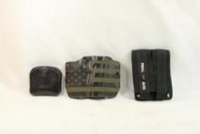 Molded plastic holster, one nylon dual mag carrier and one leather dual mag holder for .45 govt