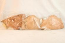 Three leather rifle cheek pads, new in pkg