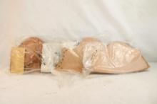 Three leather rifle cheek pads, new in pkg