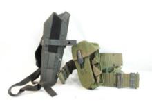 One black nylon over shoulder holster and one military belt with ammo pouches