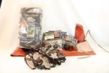 One Hide um Hunter personal one size fits all camo cover, four camo gun socks, three pair of camo