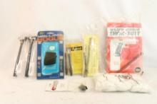Mag of gun items including two AR-15 charging handles, coil spring kit for 1911 style auto pistol,