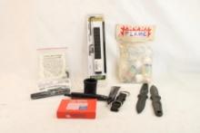 Bag containing Leupold 1 pc base for Whby short action, matchless flame starters, combat bolt handle
