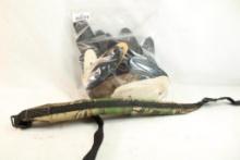 Camo padded gun sling and a bag of miscellaneous butt plates and pads