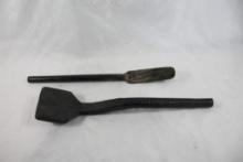 Two cast iron cooking implements