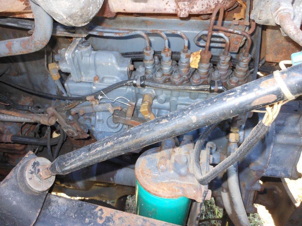 1996 Mack DM690S Tri-Axle Rolloff Truck