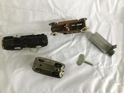 4 small tin litho cars - 1 in garage - all 1 $$