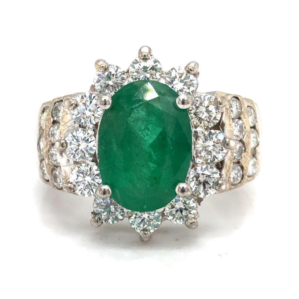 Oval-Cut Emerald and Stately Diamond Halo Ring
